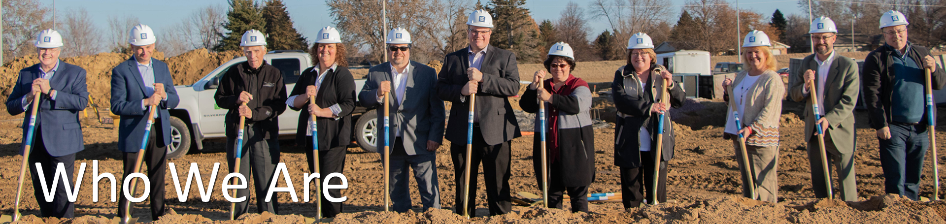 Leaders holding shovels